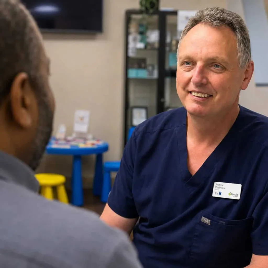A dentist talking with a patient