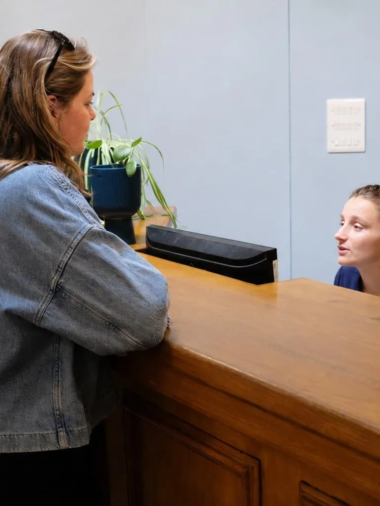 A patient at the Diamond Court front desk