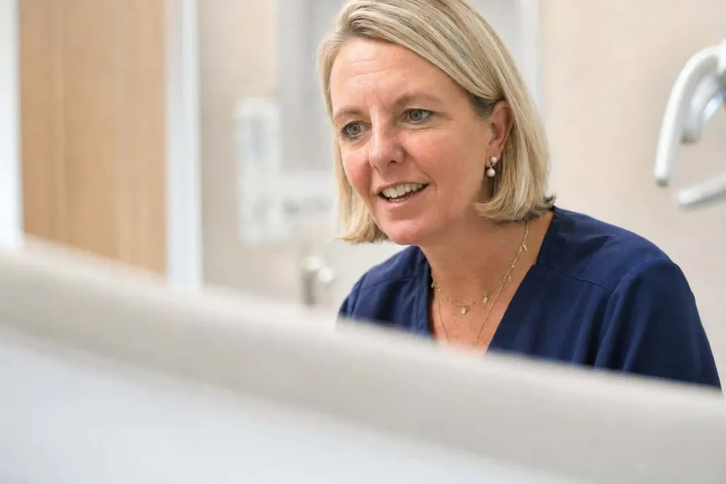 A member of the dental team at reception