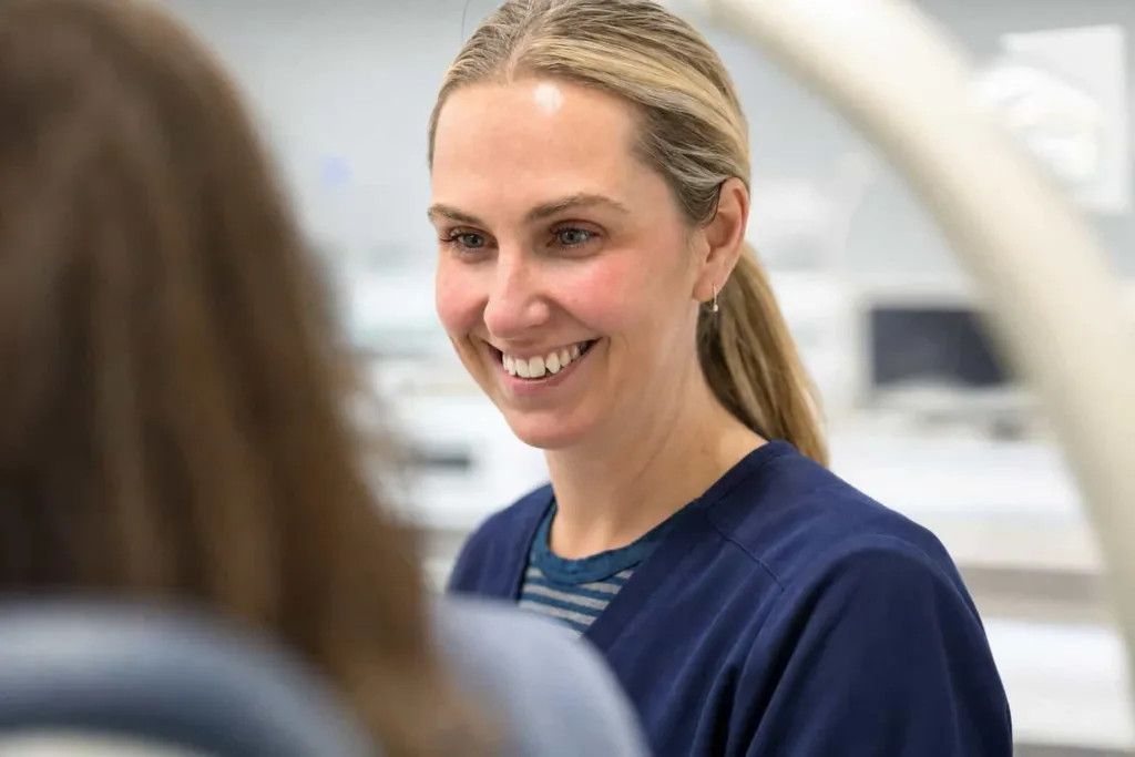 A hygienist smiling in the surgery