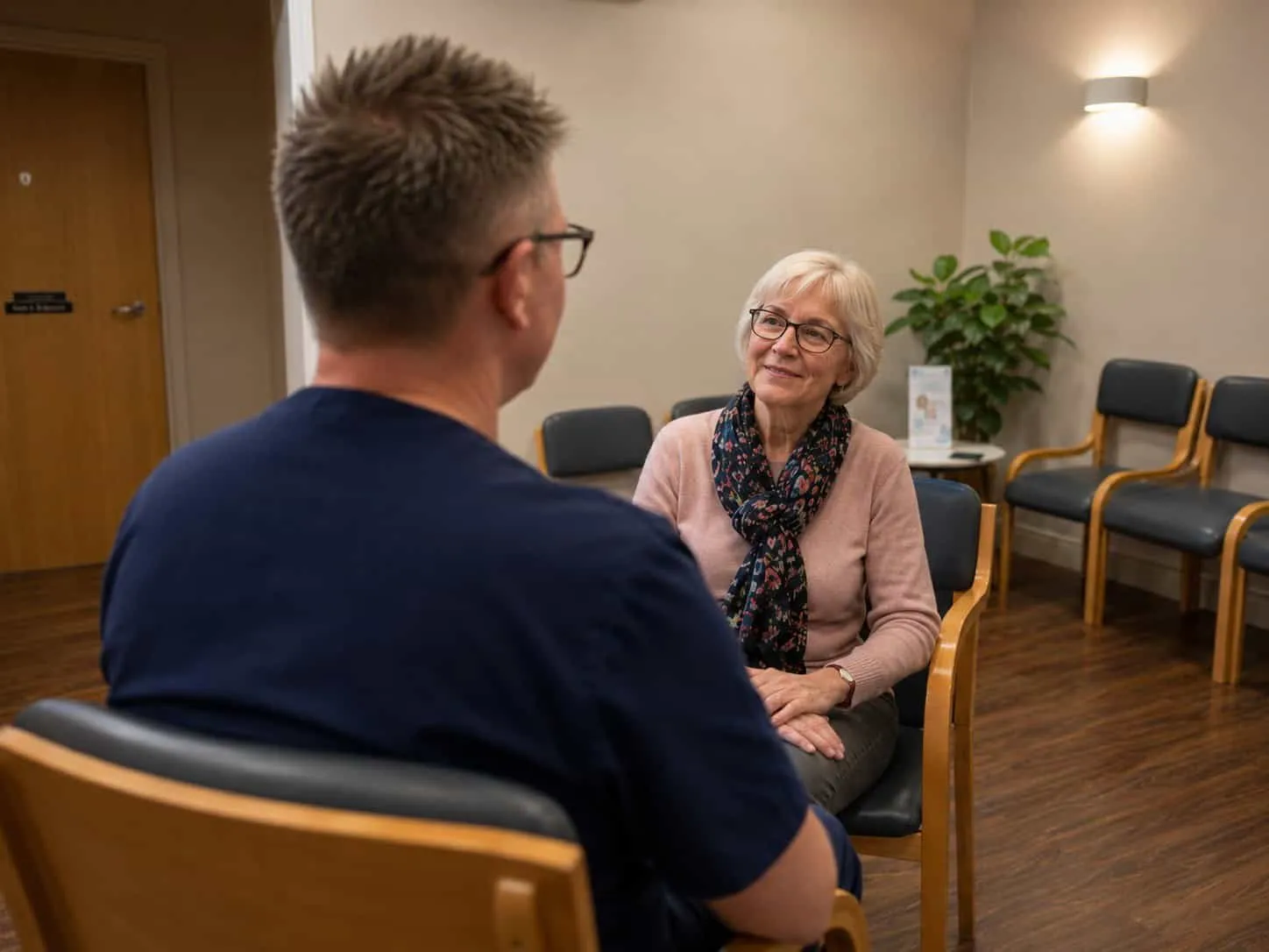 A dentist with an older patient