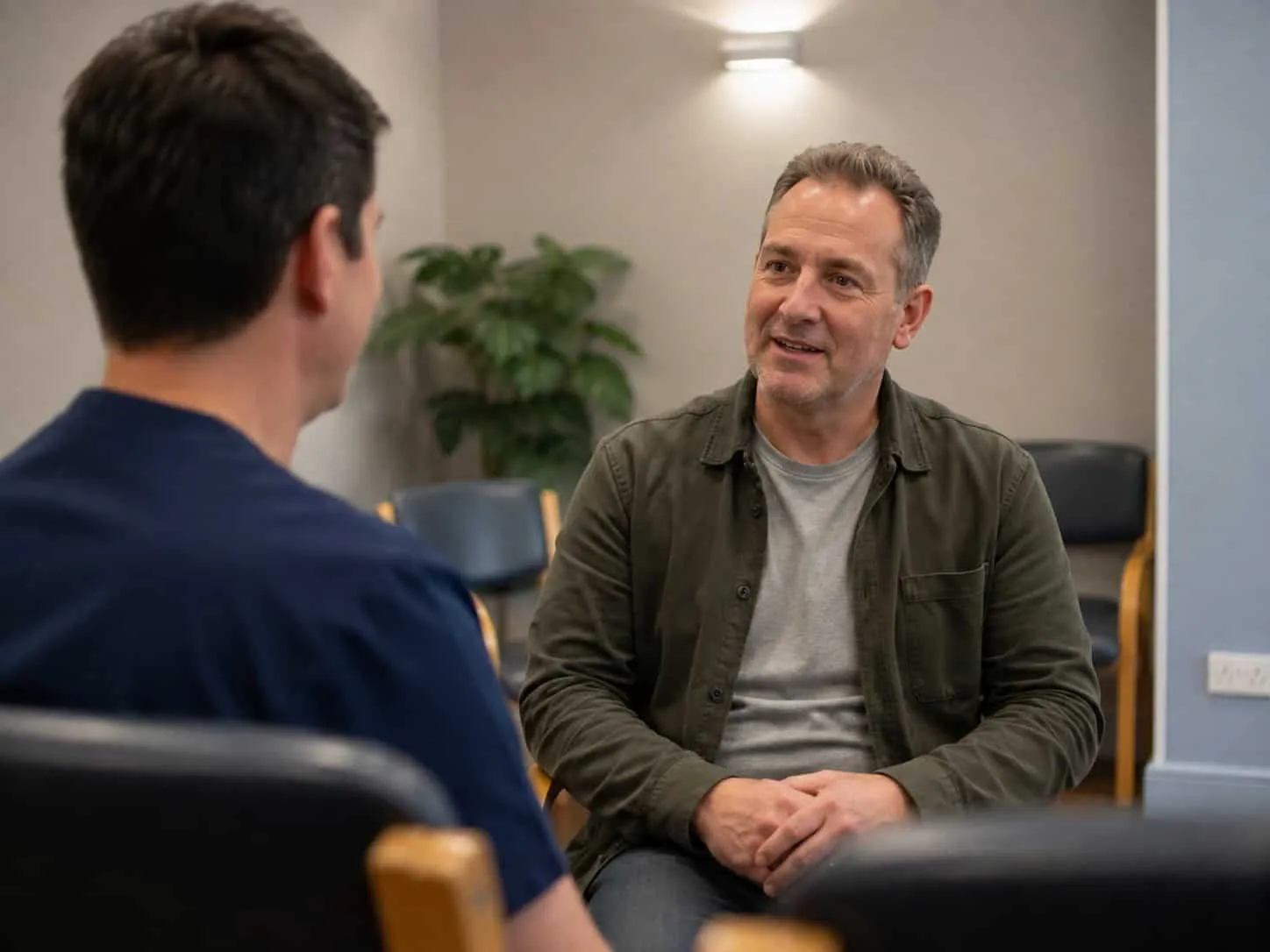A dentist with an older patient