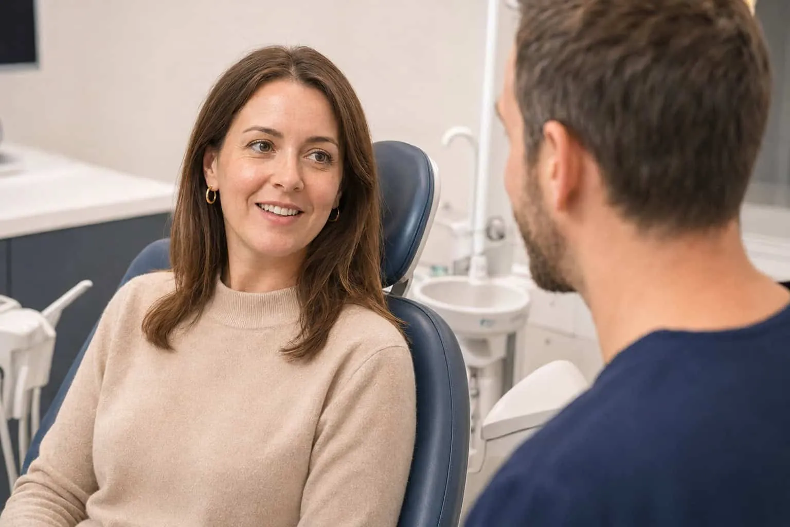 A patient smiling in the dental chair