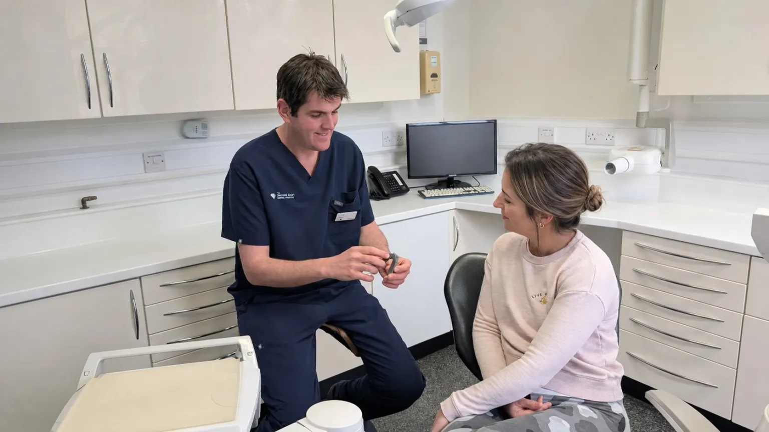Paul Flint with a patient in the treatment room